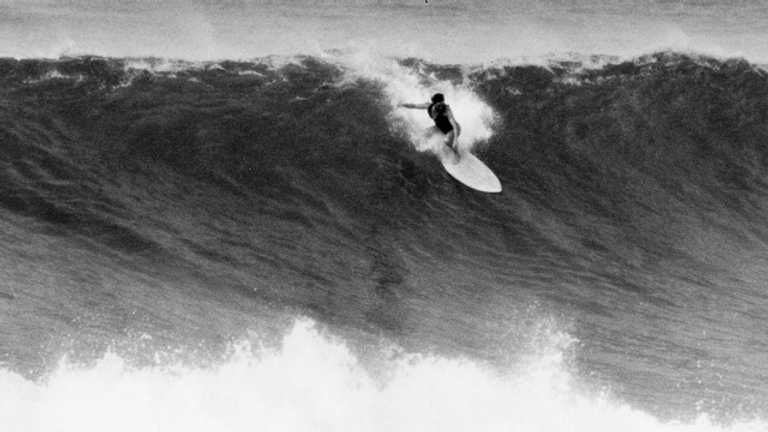 Jericho Poppler drops into a big wave at Sunset Beach, Hawaii