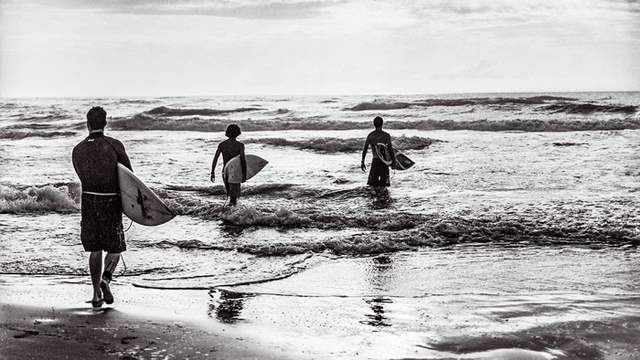 Surfers at South Padre Island. Photo: Kenny Braun