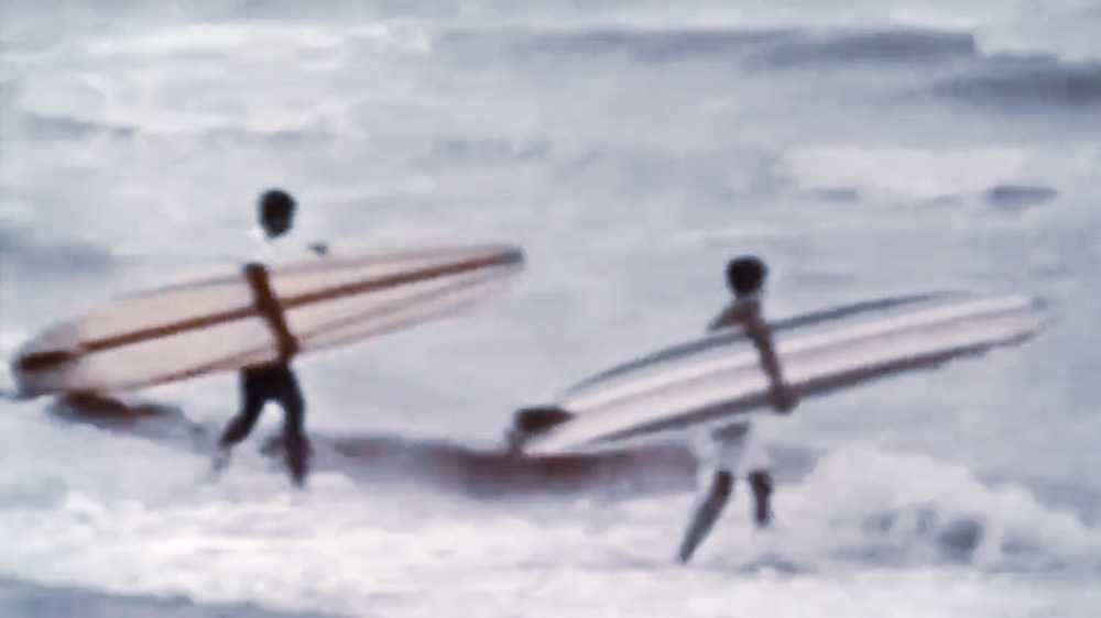 surfers in biloxi going out in a hurricane