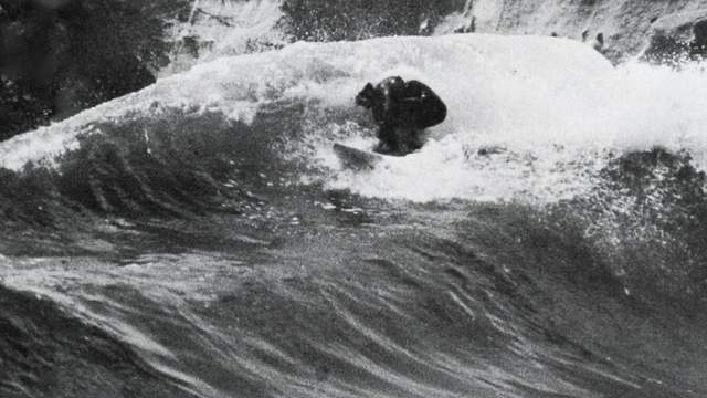 Surfer on a double-up wave, Santa Cruz County, 1972
