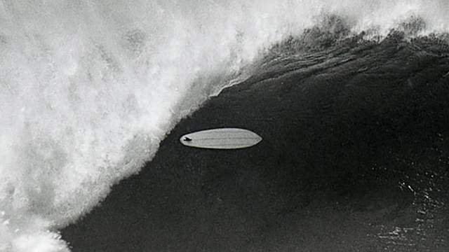 Single-fin surfboard at Pipeline, early 1970s. Photo: Jeff Divine