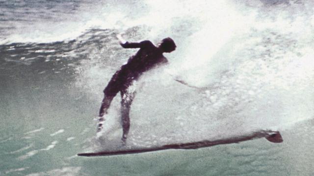 Mike Doyle, standing island pullout, Makaha, 1959. Photo: John Severson
