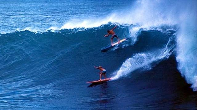Walt Phillips, below, and Tiger Espere, Waimea Bay, mid 1960s