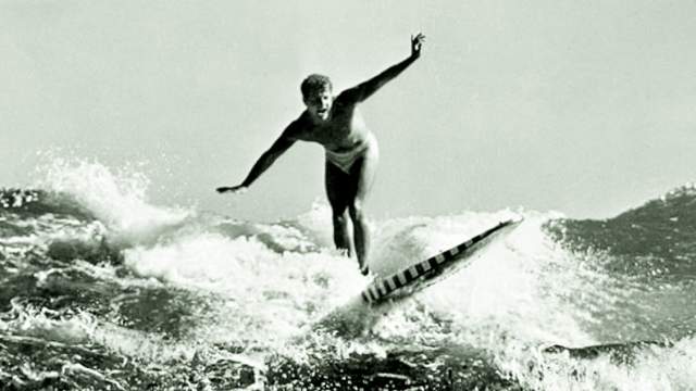 Bondi Beach surfer on hollow board, 1950