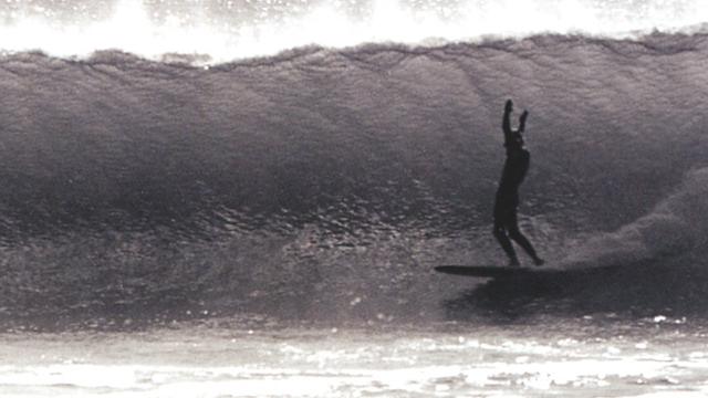 Bob Cooper facing a long wall at Rincon, 1964. Photo: Ron Stoner