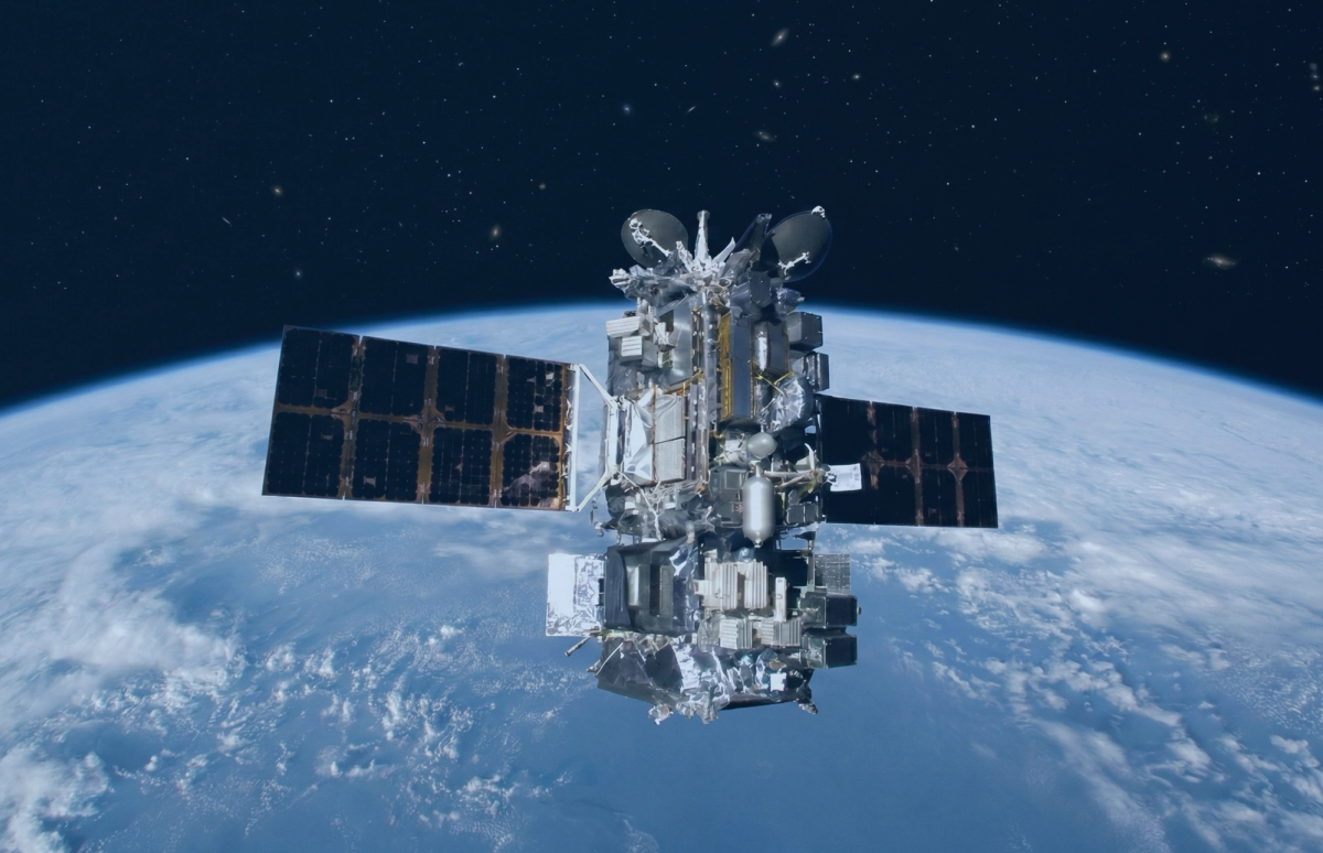 An image of a satellite in space orbiting earth