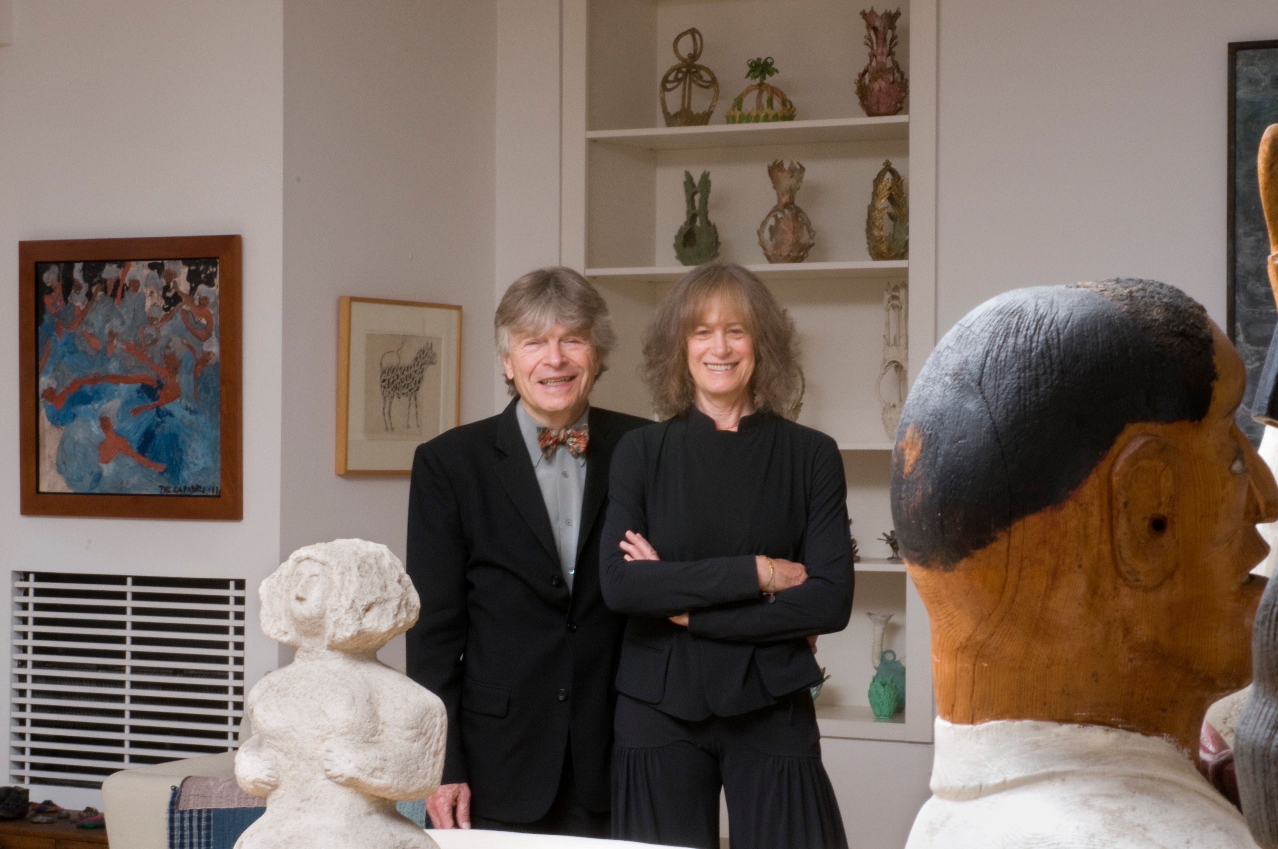 Donors Jill and Sheldon Bonovitz smiling for a portrait in a gallery