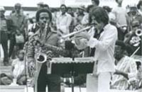 <b>Fig. E</b> Enrico Rava (right) and students
from Atlanta University in an
outdoor jazz performance
© 1979 Cary Cleaver