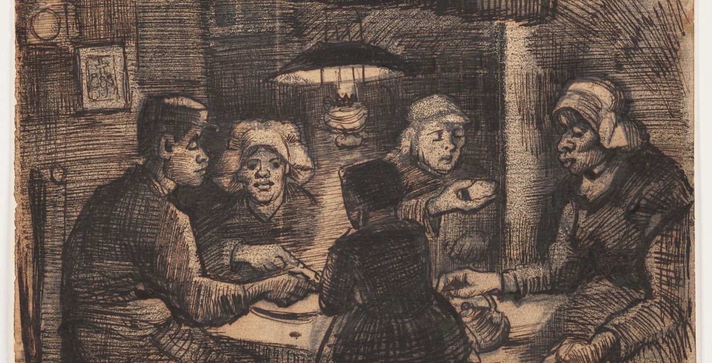 Image of a family eating potatoes at a table.