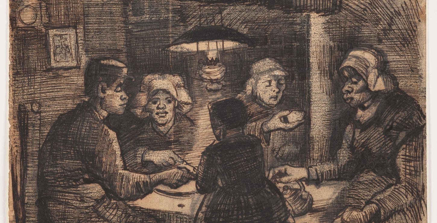 A family eating potatoes at a table.