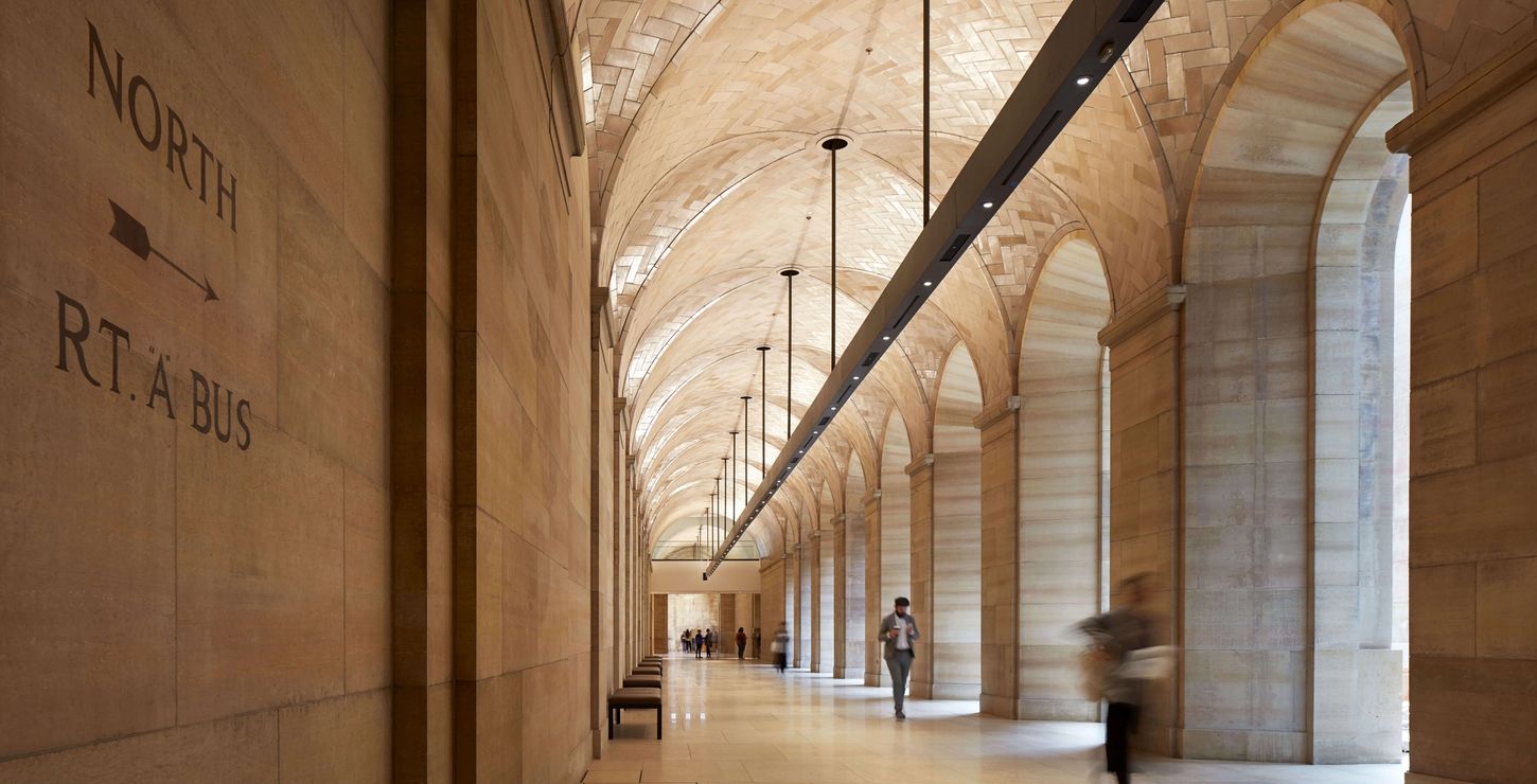 People walking through the North Vaulted Walkway.