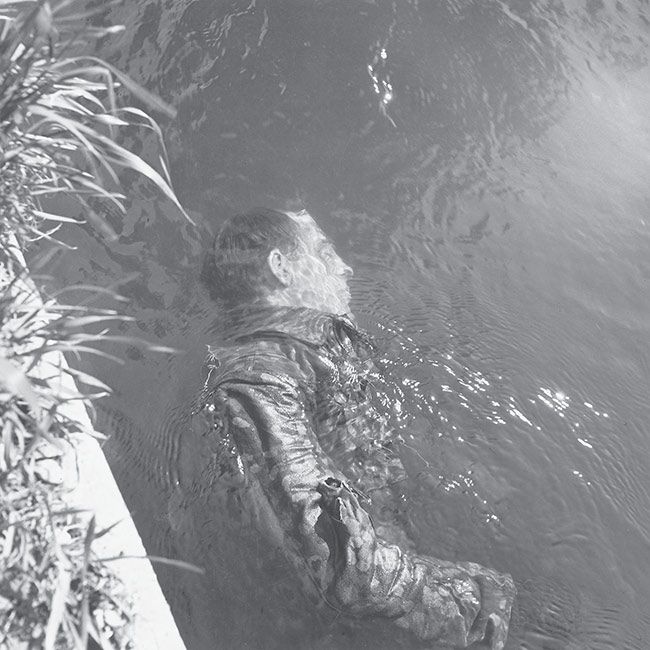 Lee Miller
<i> Dead SS Guard in the Canal</i>, 1945
© Lee Miller Archives, England 2008. All rights reserved. www.leemiller.co.uk.