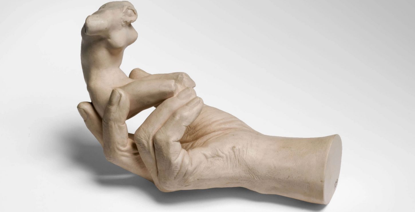 Hand of Rodin Holding a Torso, 1917, by Auguste Rodin