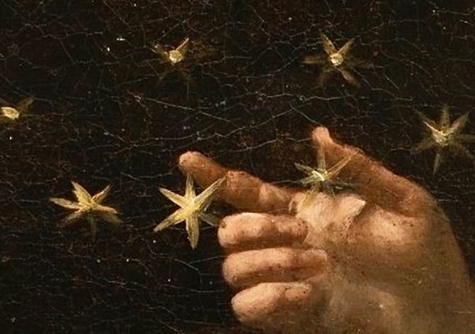 Hand touching stars