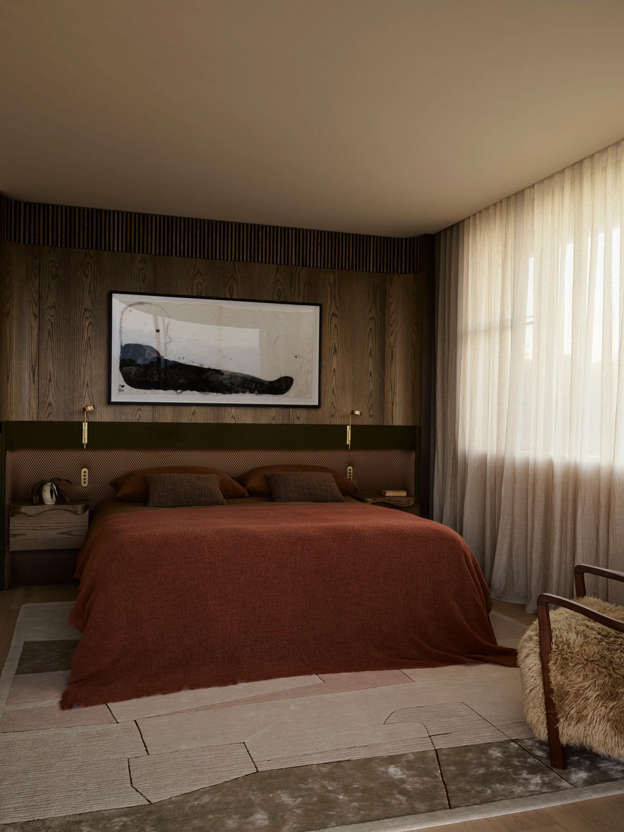 Patchwork "Warm bedroom with a rust-toned bed, upholstered headboard with brass reading lights, fluted wood-panelled wall behind an abstract framed artwork, layered textured rugs, and sheer curtains beside a shaggy accent chair.