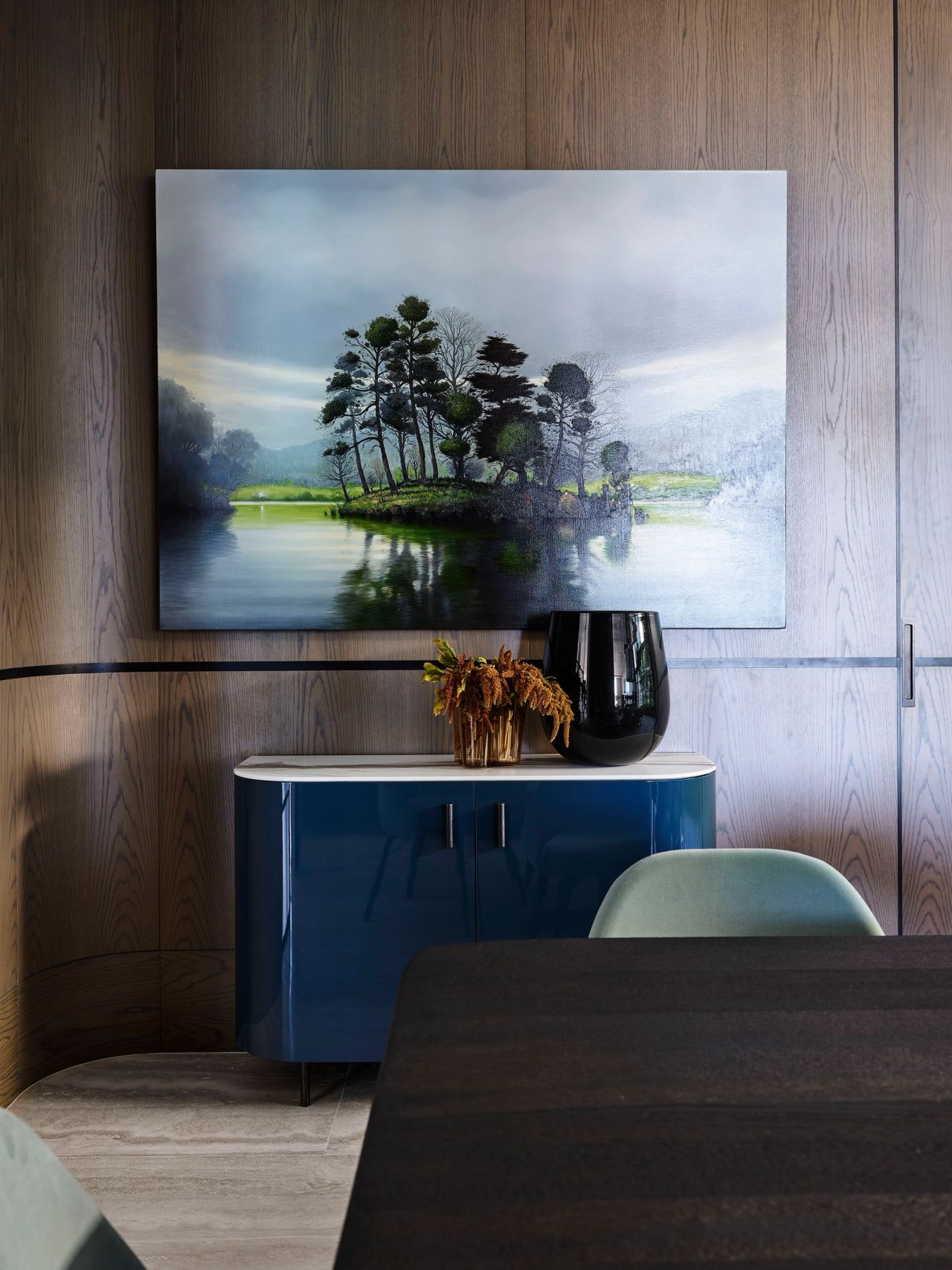 Hill house formal dining room artwork of a landscape with a blue console below