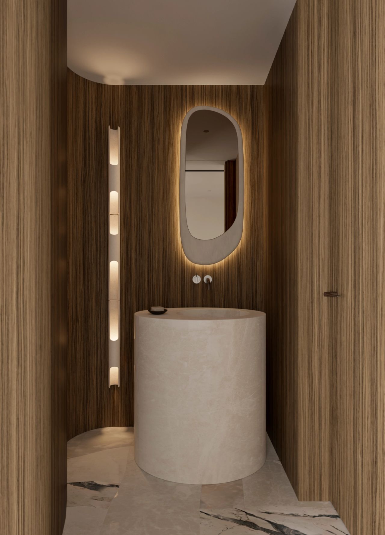 Park Cylindrical stone pedestal basin beneath a backlit oval mirror, set against curved wood-panelled walls with a vertical ribbed light fixture