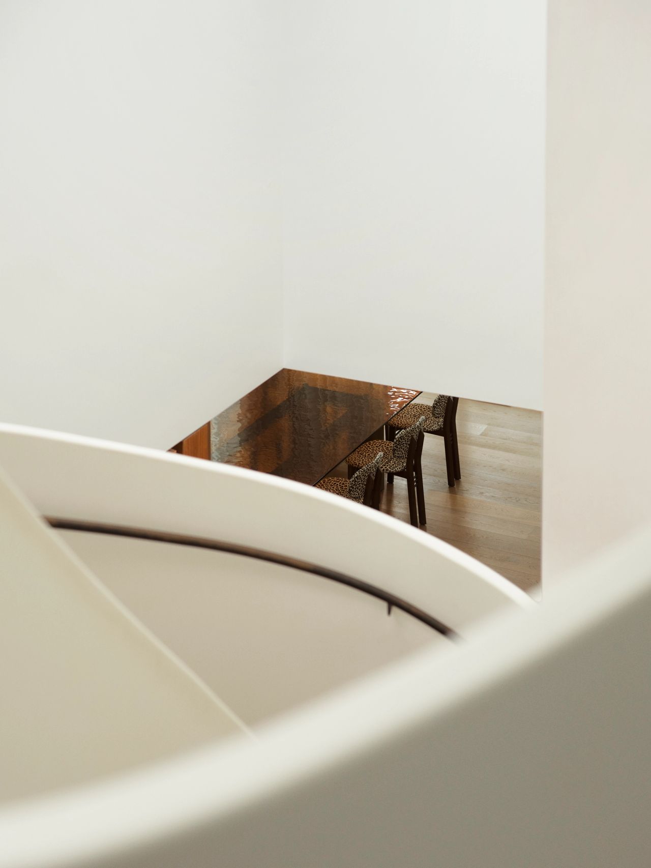 Dancing on the Ceiling curved render detail of staircase and chairs in the background 