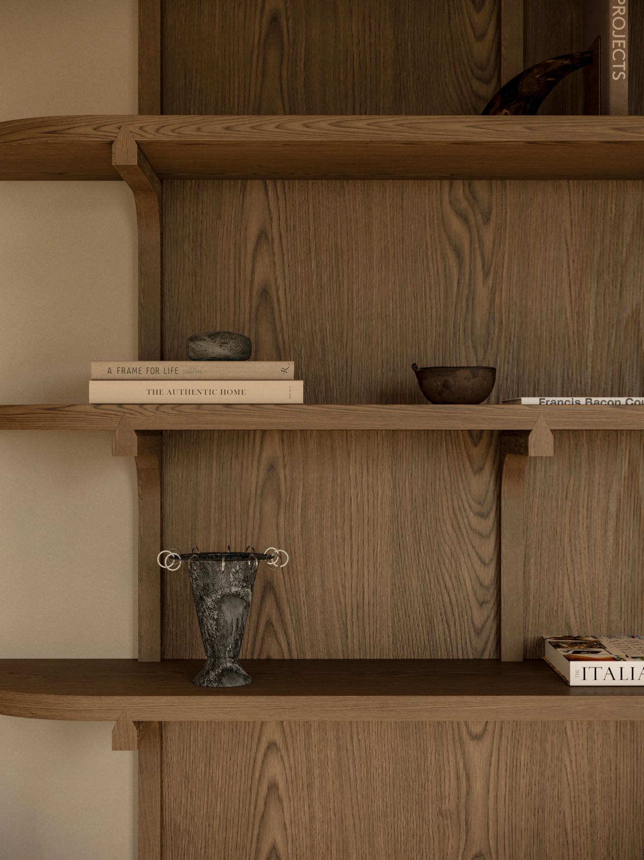 Lady M Close-up detail of a timber-framed sliding door with woven cane or textile panels and a sculptural integrated handle, opening onto a study with a curved window seat, timber shelving, and a patterned rug beyond.