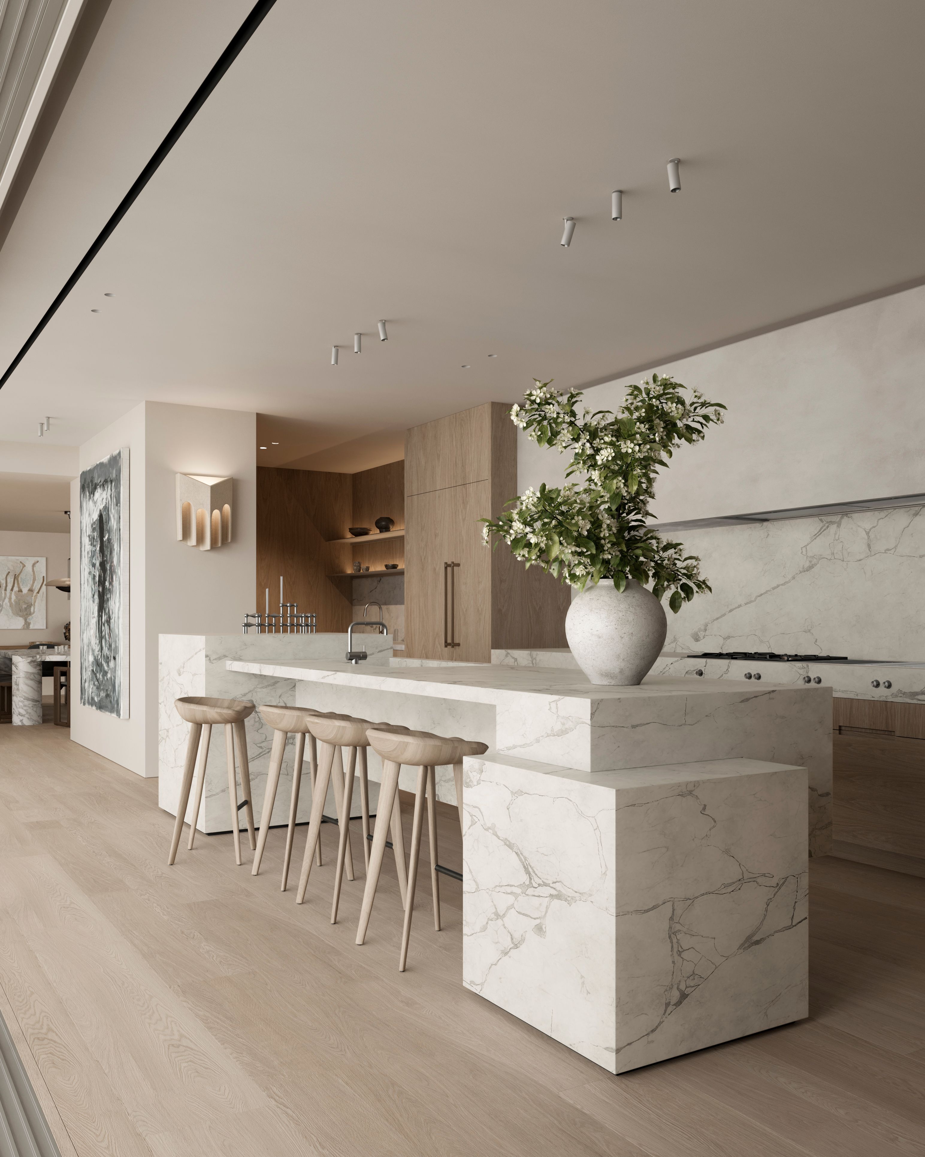 Park White marble kitchen island with sculptural bar stools, a large flowering vase, marble backsplash, and a wall sconce, with open shelving and cabinetry visible in the background