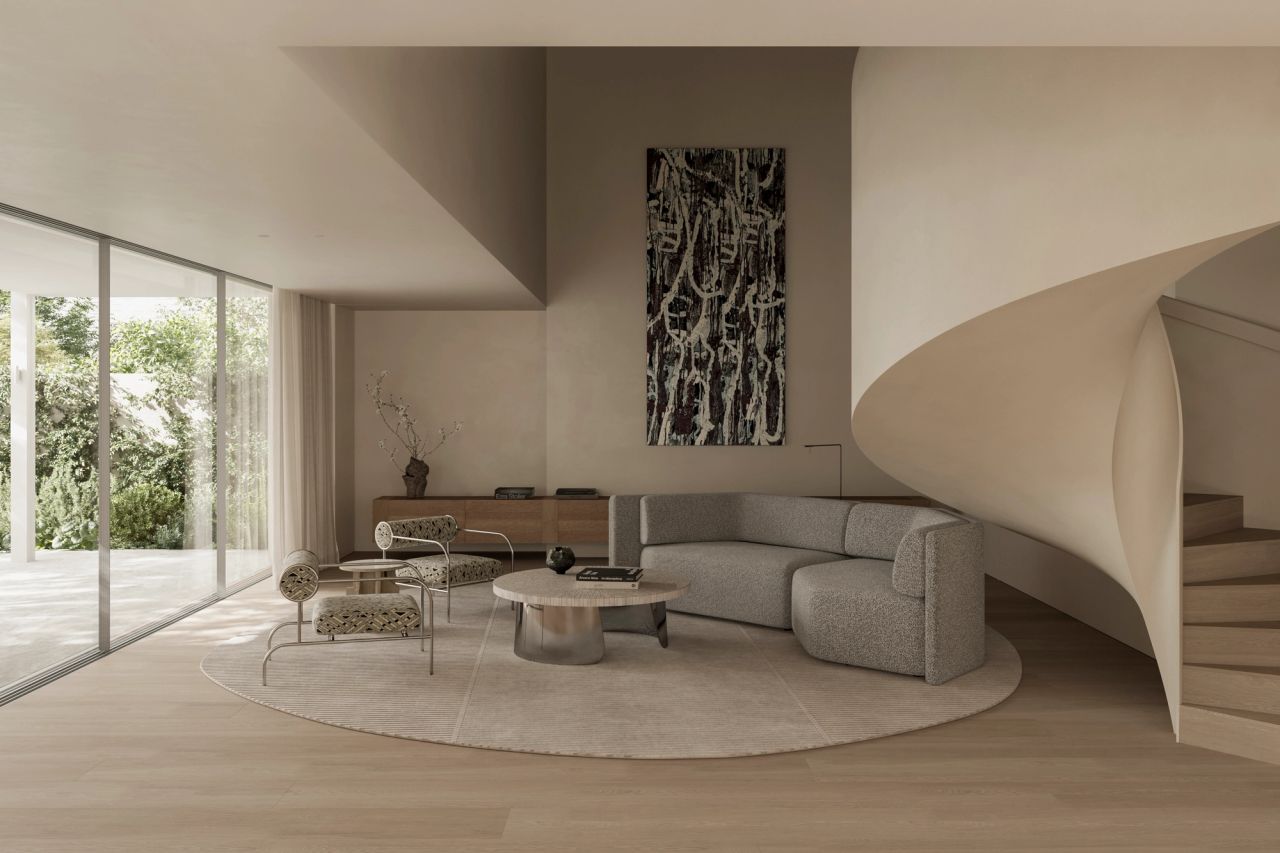 Park Double-height living room with a curved sculptural staircase, a tall abstract black-and-white artwork, a grey bouclé sofa, a low round coffee table, and floor-to-ceiling glass doors opening onto greenery
