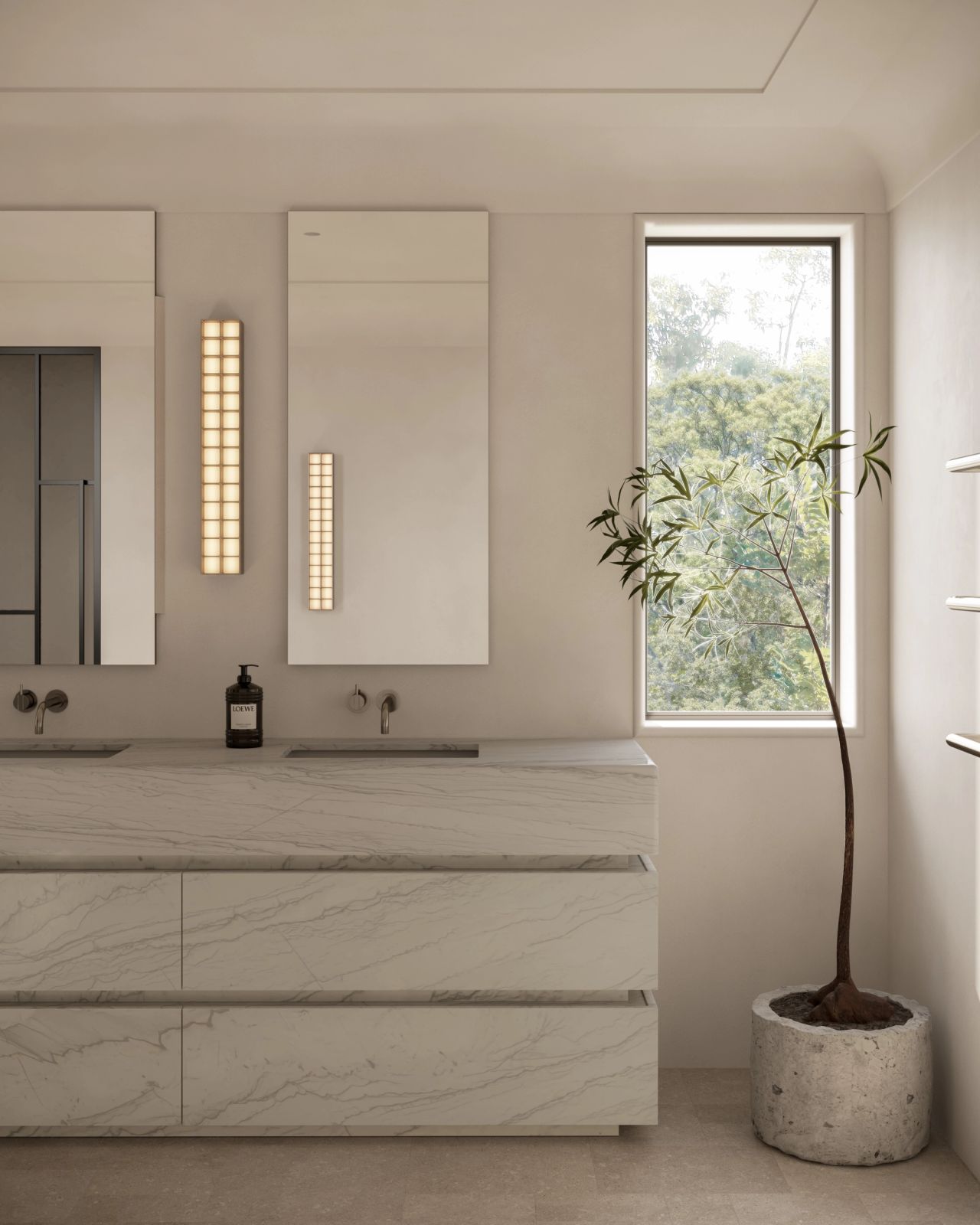 Light-filled contemporary bathroom with a veined natural stone double vanity, integrated basin, illuminated mirror and sculptural indoor tree beside a garden-facing window.