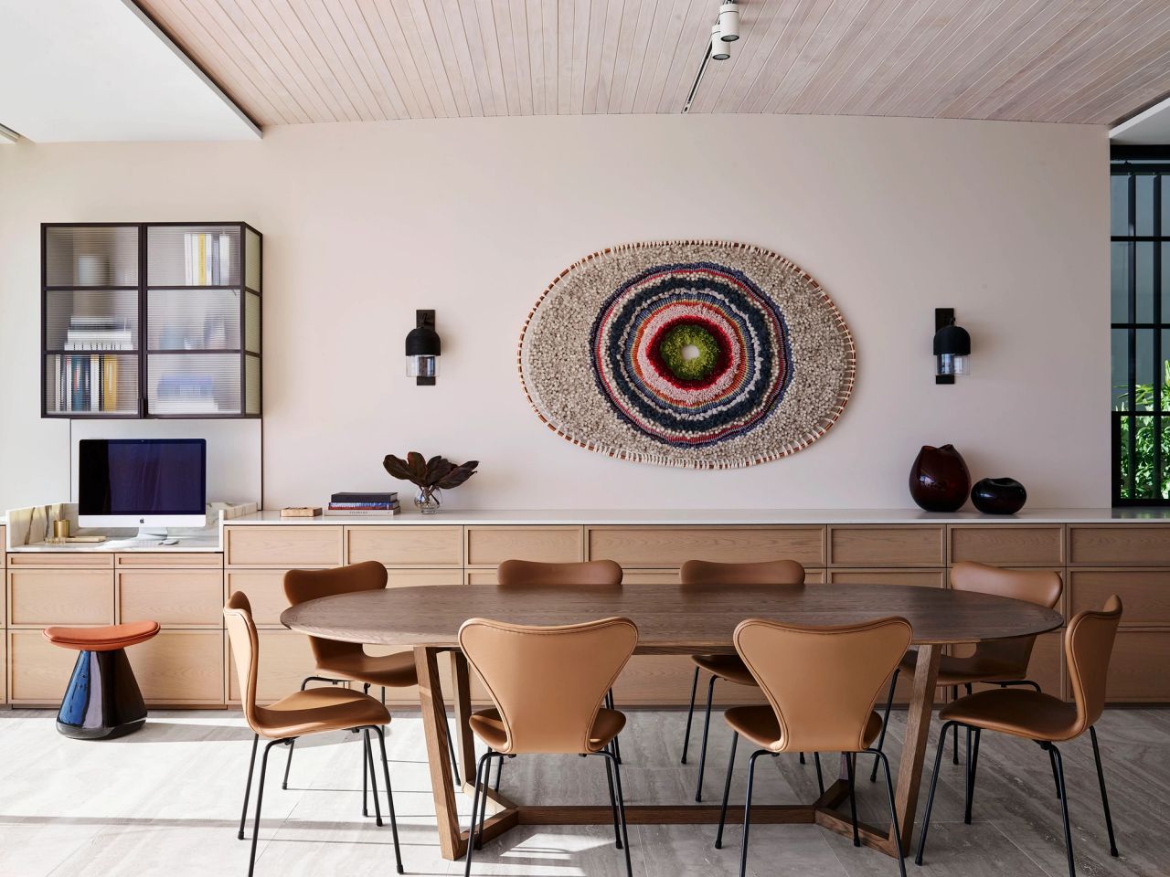 Hill house dining space timber joinery, timber dining table and leather tan chairs in the foreground 
