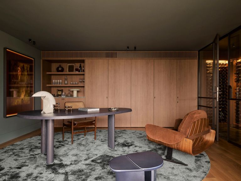 Contemporary home office featuring Jorge Zalszupin's Presidential Armchair in walnut and leather.
