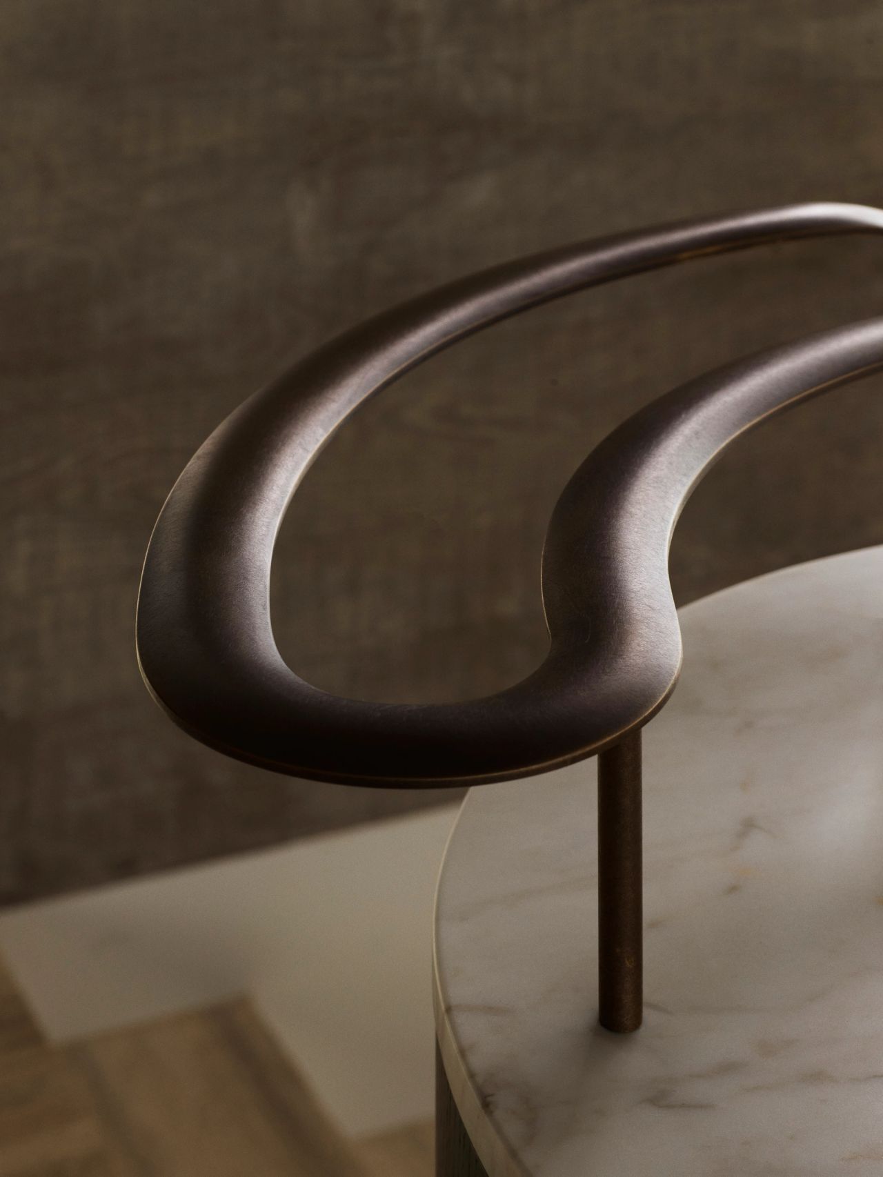 Orla Contemporary Brazilian influence dark bronze patinated curved balustrade joinery with stone top