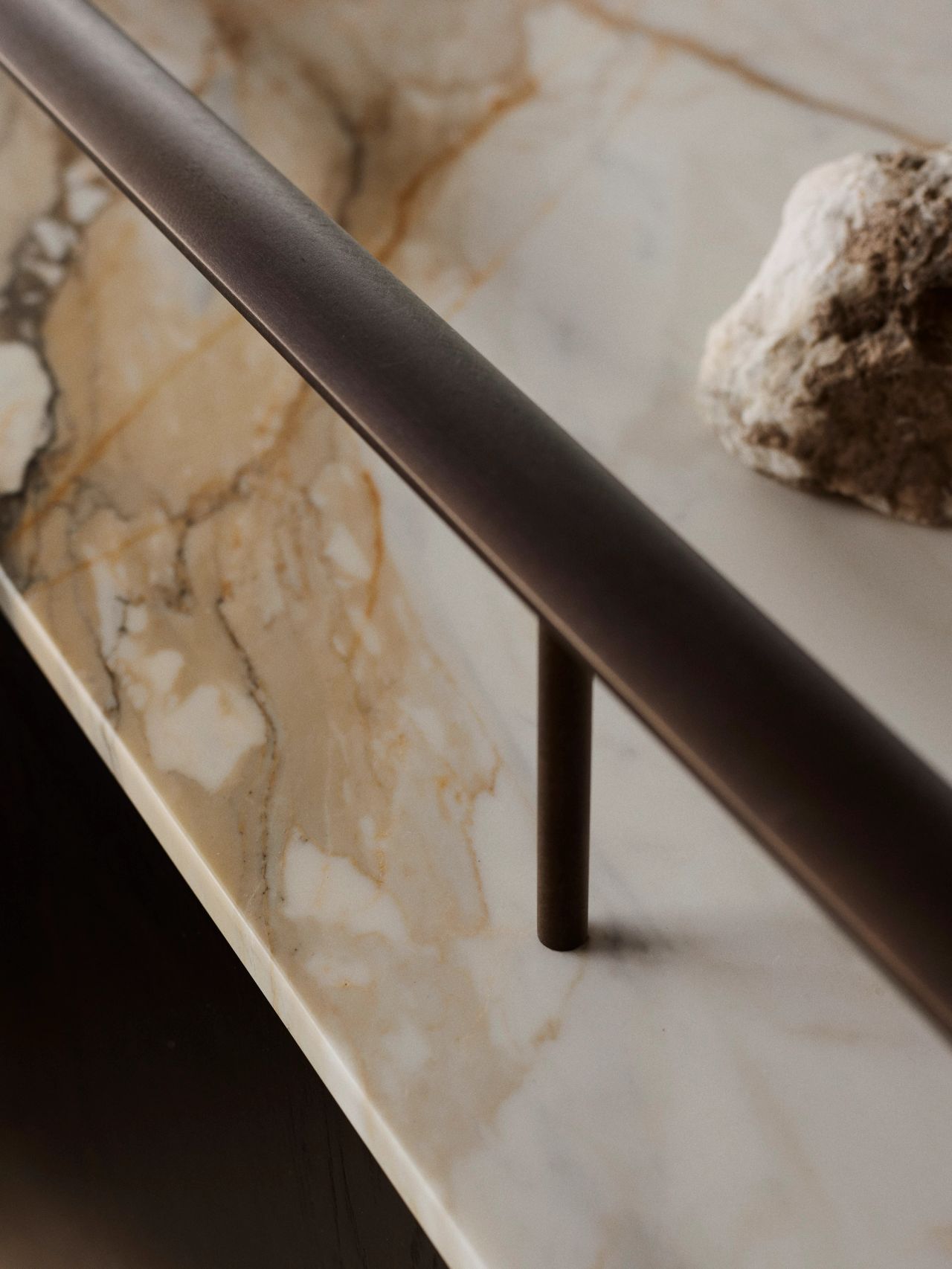 Orla Contemporary Brazilian influence dark bronze patinated balustrade joinery with stone top