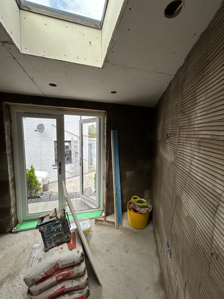 Extension interior showing blockwork and backing coat