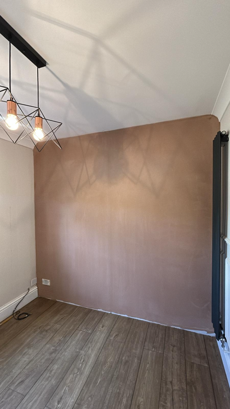 Bedroom with newly skimmed walls and timber flooring