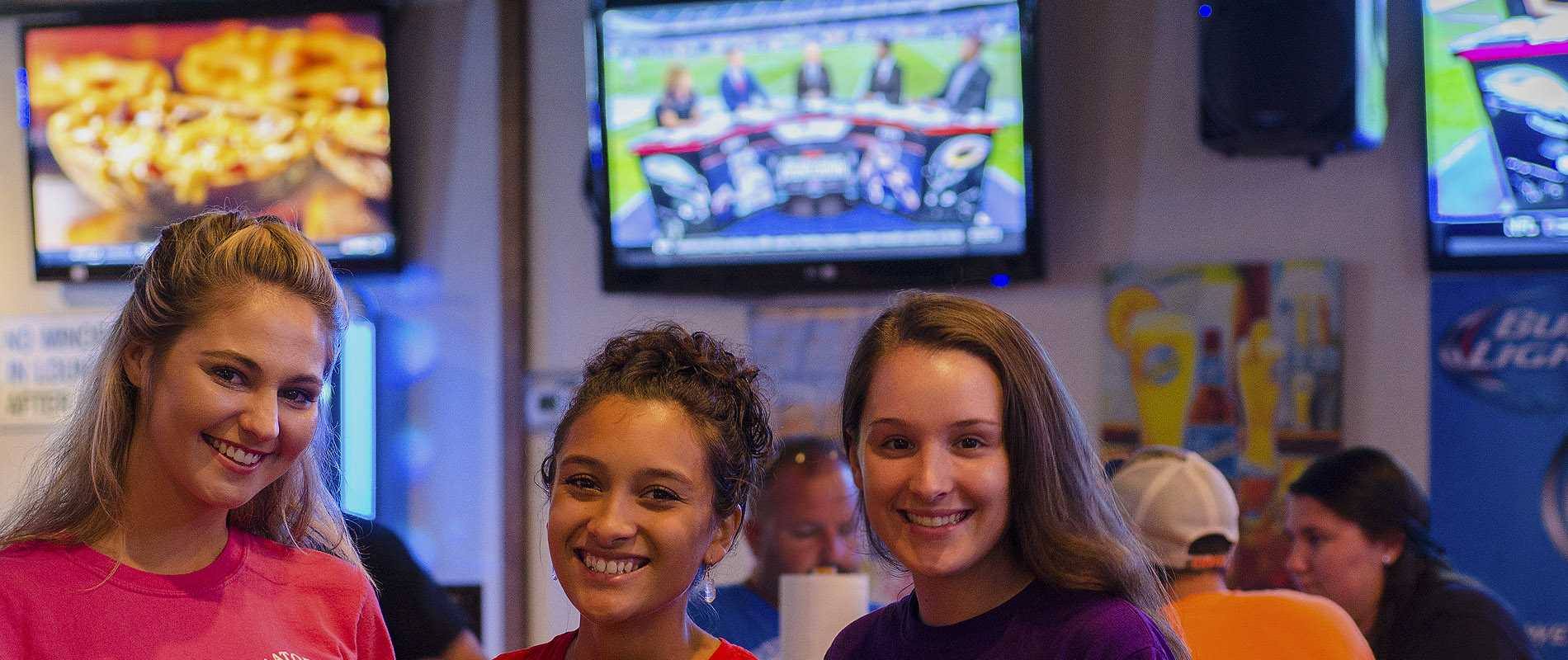 Gator's Dockside servers smiling in the dining room