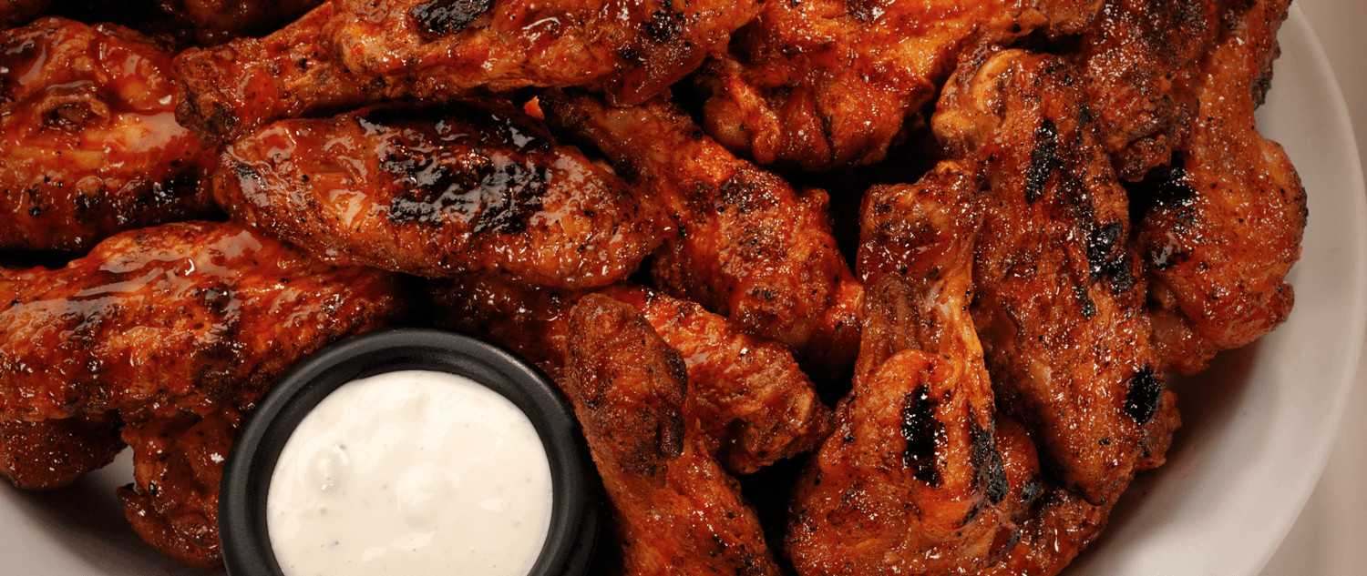 A plate of Gator's grilled wings with ranch
