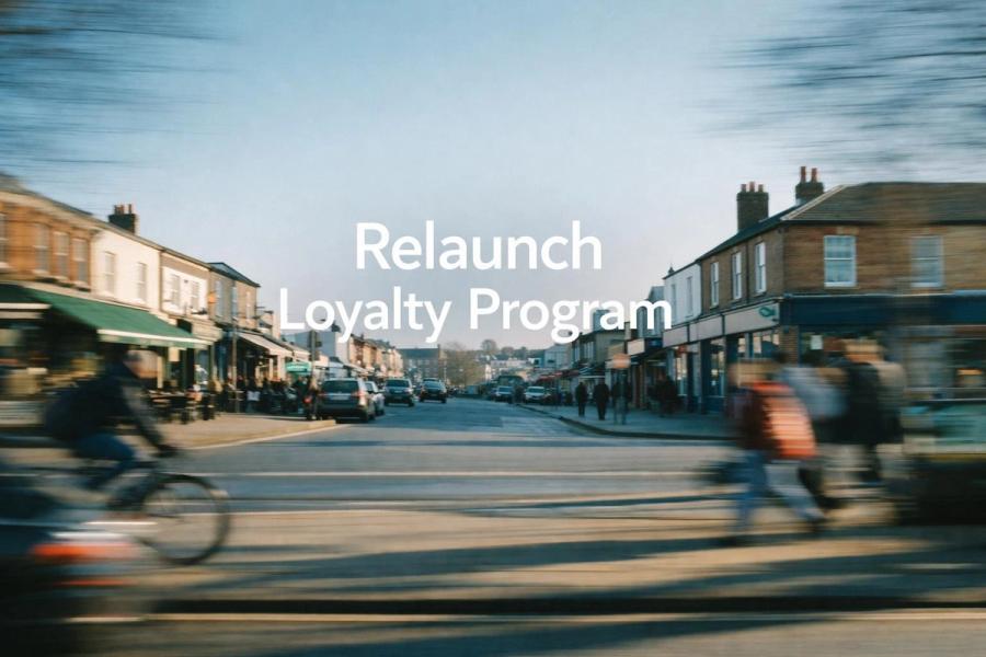 White text reading “Relaunch Loyalty Program” over a soft gradient background.