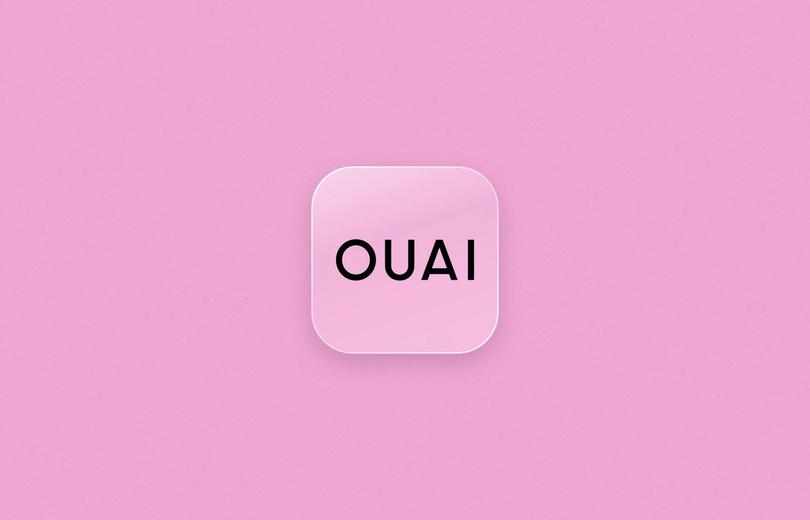 OUAI logo on a frosted glass tile over a soft pink background