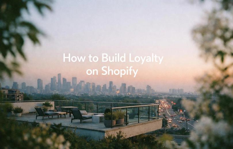 Minimalist landscape with "How to Build a B2B Loyalty Program on Shopify" text overlaid in sky, representing a guide to imple