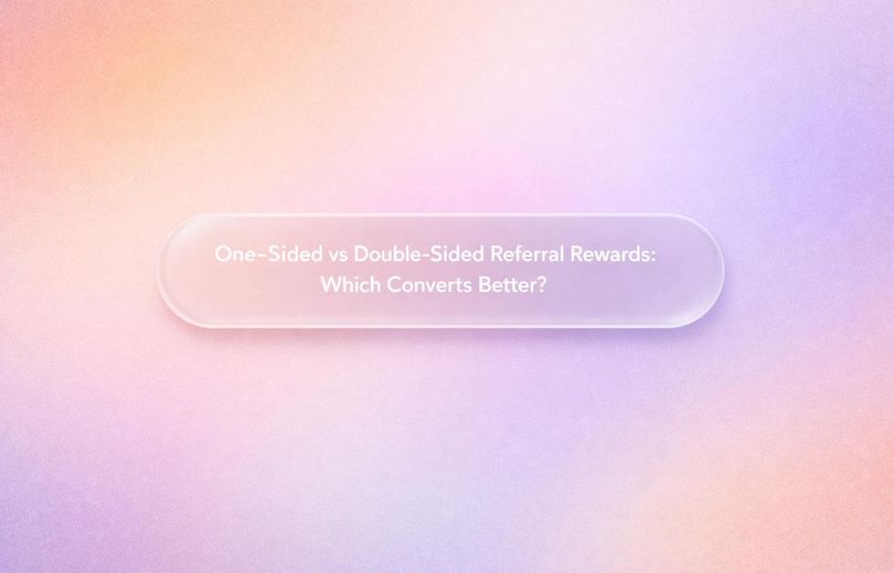 Graphic displaying the title “One-Sided vs Double-Sided Referral Rewards: Which Converts Better?” over a soft gradient backgr