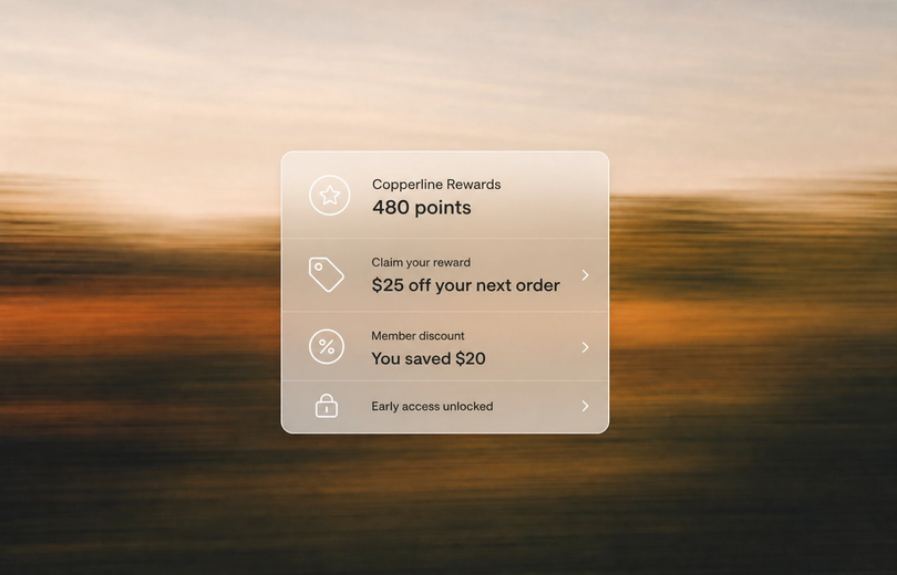 Minimalist landscape with article title about Shopify loyalty apps rendered as text in the sky, representing best apps for su