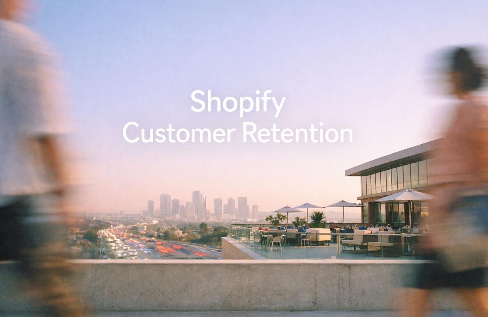 White text reading "Shopify Customer Retention" over a rooftop terrace overlooking a city skyline at dusk
