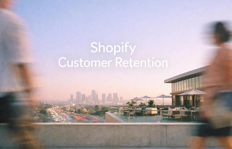 White text reading "Shopify Customer Retention" over a rooftop terrace overlooking a city skyline at dusk