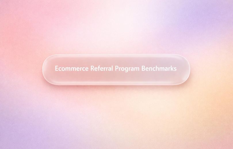 White text reading “Ecommerce Referral Program Benchmarks” over a soft gradient background