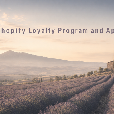 Minimalist landscape with "Does Shopify Have a Loyalty Program? (And the Best Apps to Build One)" text overlaid in the sky, r
