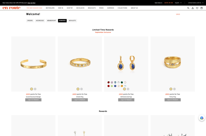 En Route Rewards page showing Limited-Time Rewards jewelry redeemable with points and Log in to Redeem buttons