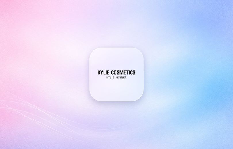 Kylie Cosmetics logo on a frosted glass tile over a soft pink and blue gradient