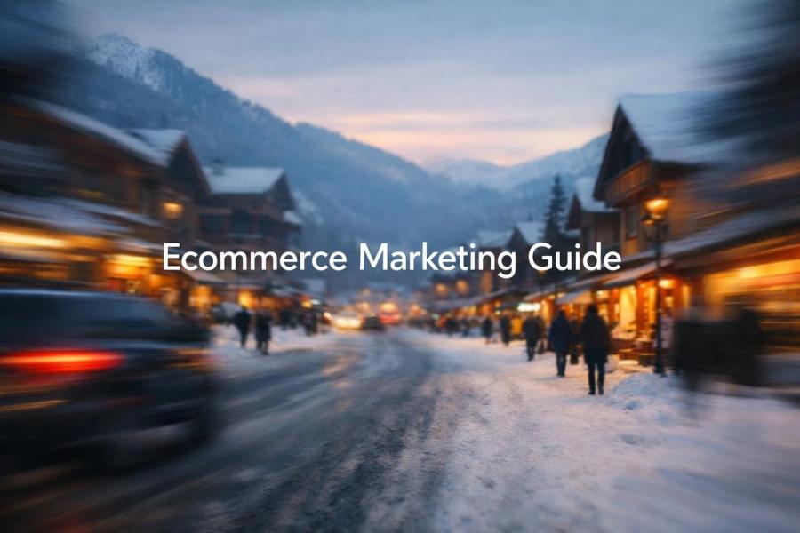 White text reading "Ecommerce Marketing Guide" over a snowy alpine village street at dusk with lit shopfronts