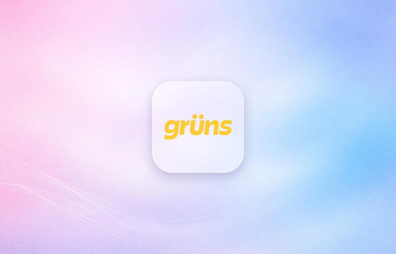 Grüns logo on a frosted glass tile over a soft lavender gradient