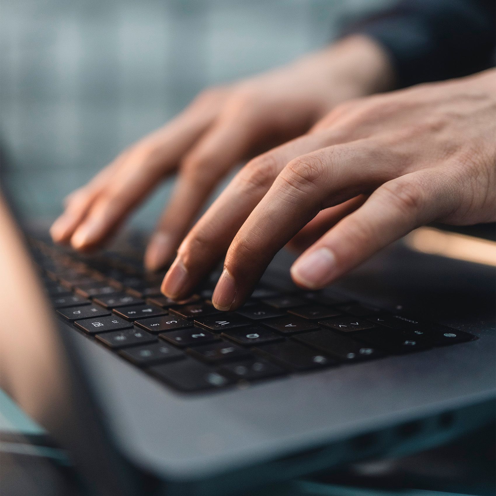 Person typing on a laptop