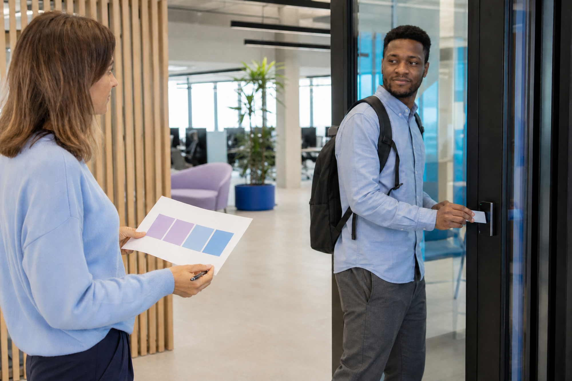 A workplace operator compares a five-day office plan with a coworker arriving through a badge-controlled door.