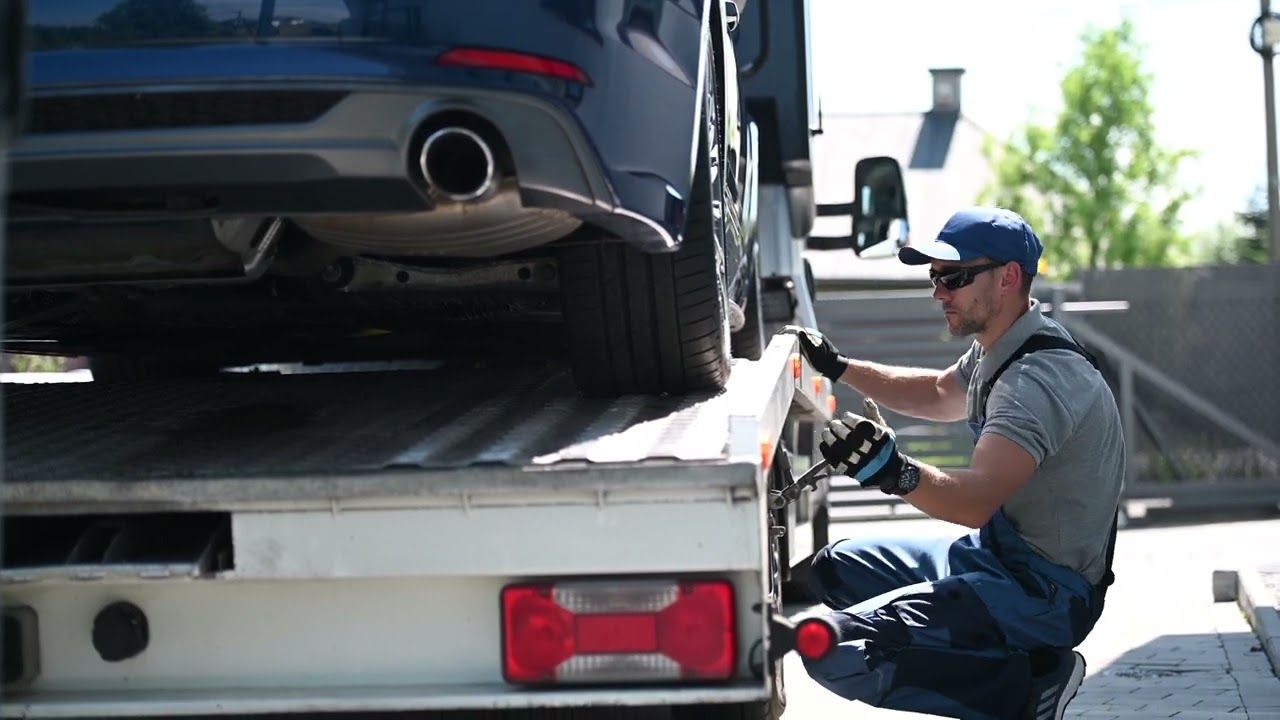 Car secured on a transport trailer